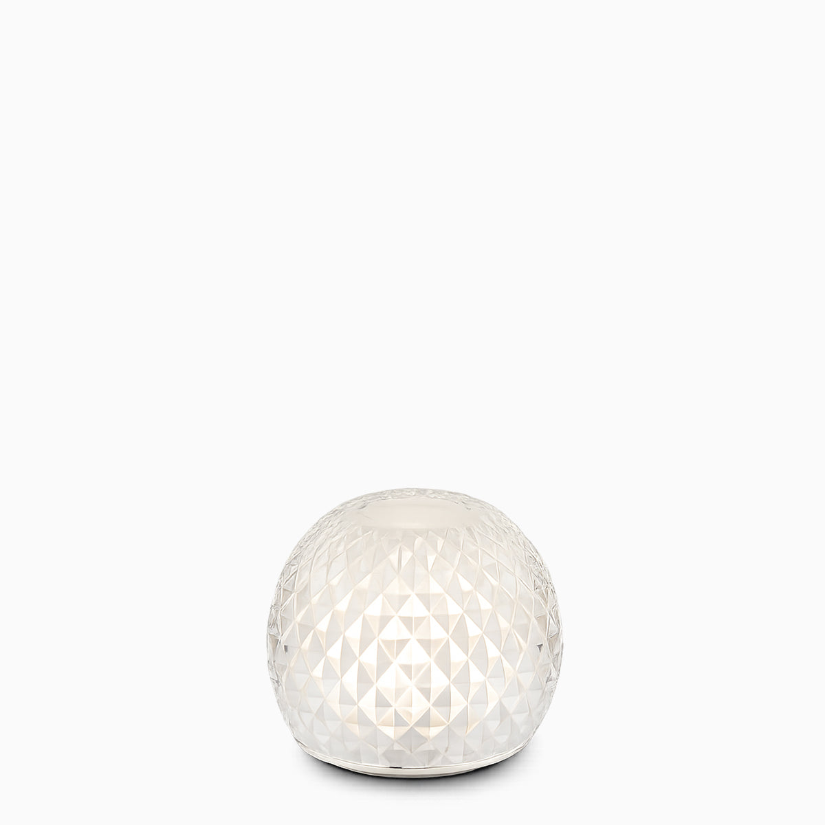 A glass spherical cordless lamp on a white background