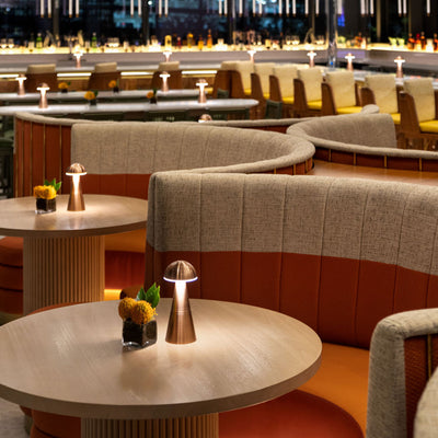 Charm Dome Rechargeable Cordless Table Lamp, Copper in a restaurant - Insight Cordless Lighting