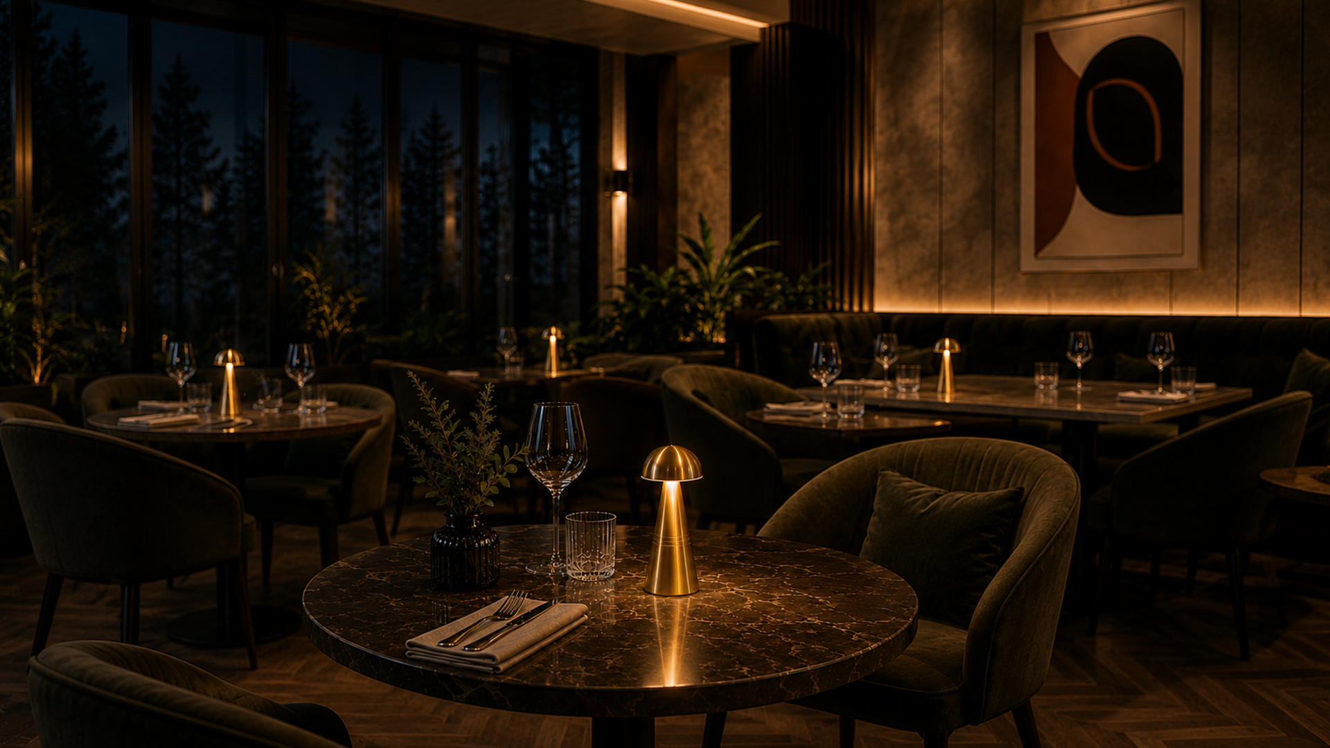 Darkly lit restaurant interior with rechargeable cordless table lamps, tables, chairs, and decorative elements.