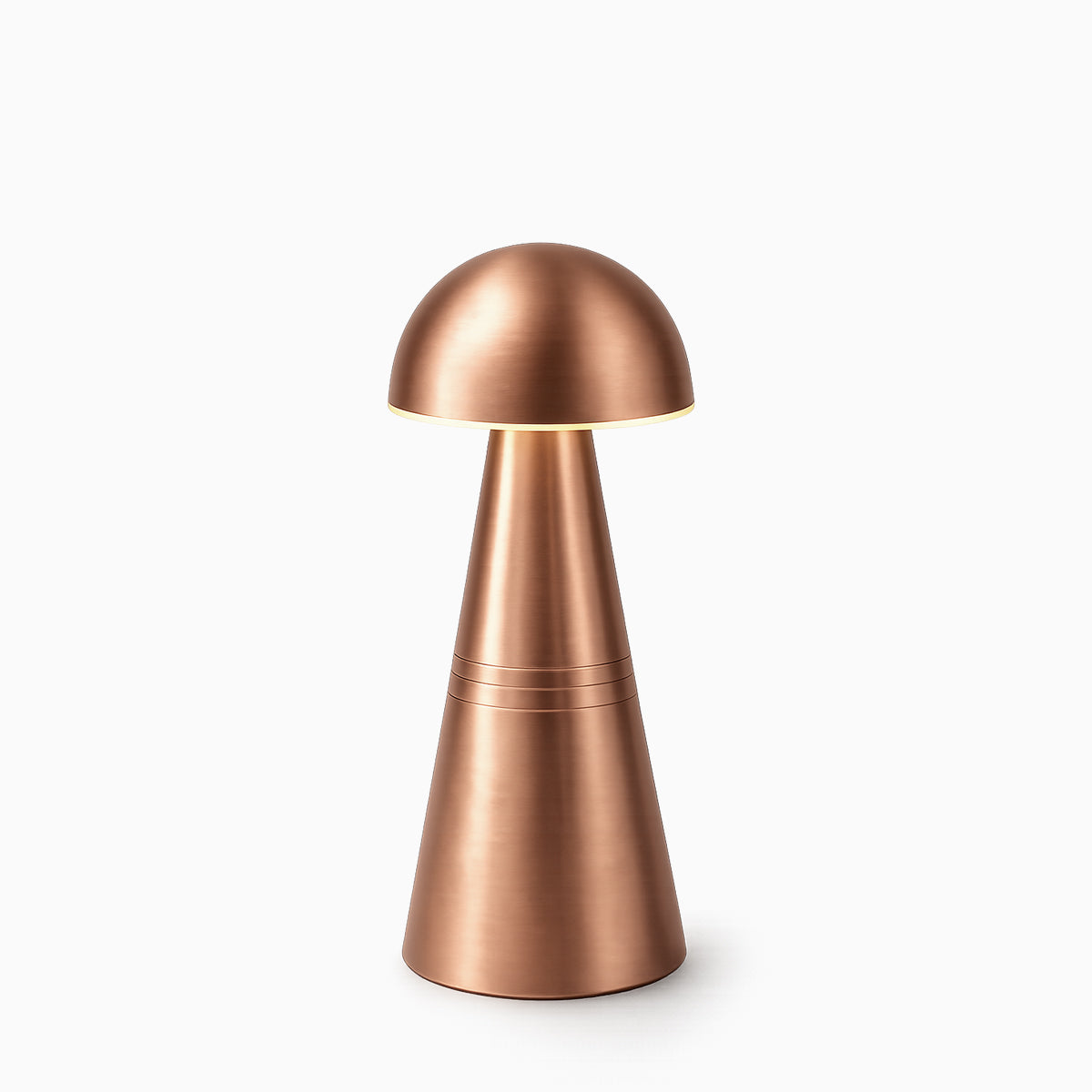 Copper cordless table lamp on a white background