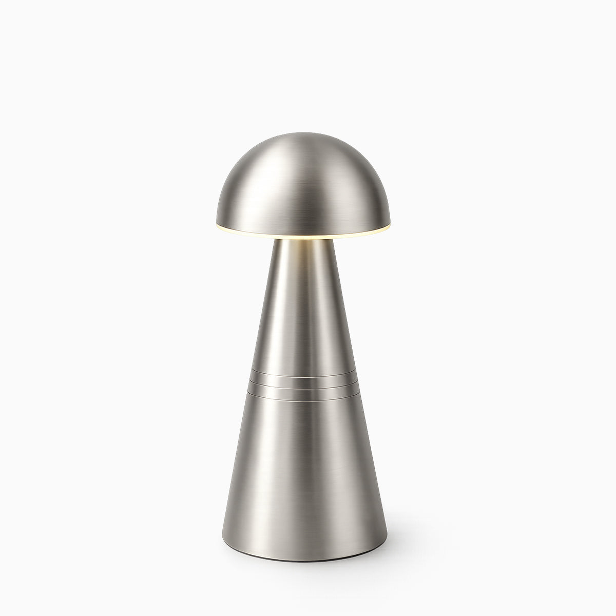 Silver cordless table lamp on a white background