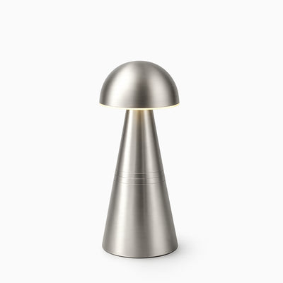 Silver cordless table lamp on a white background