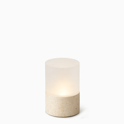 Cylindrical cordless light fixture with a stone base on a white background
