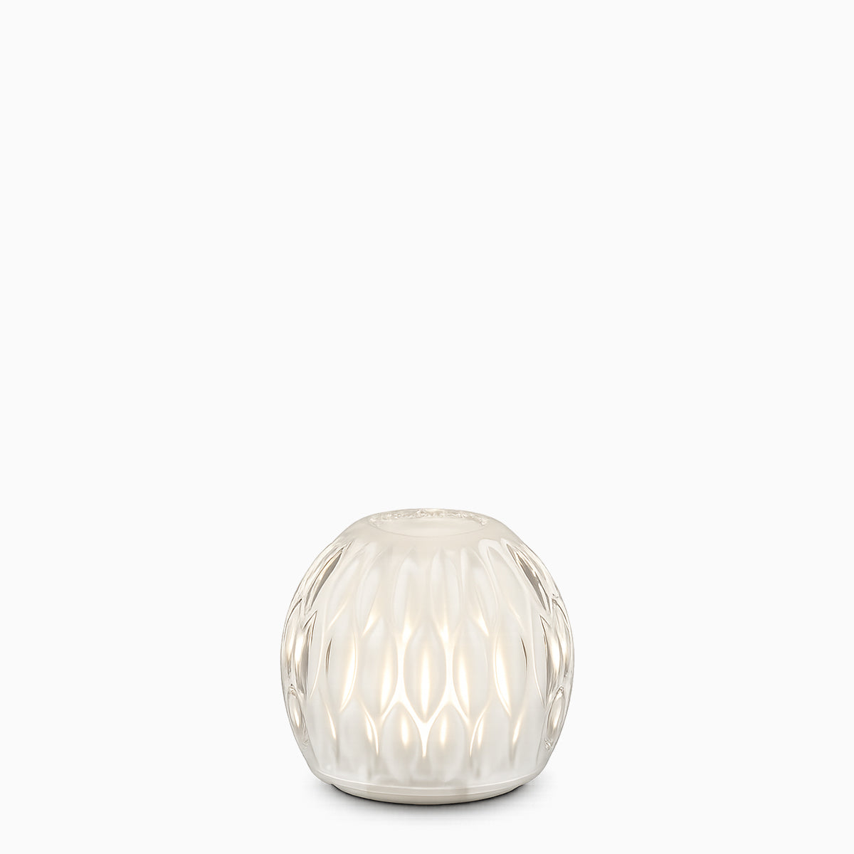 Decorative glass cordless lamp with textured surface on a white background