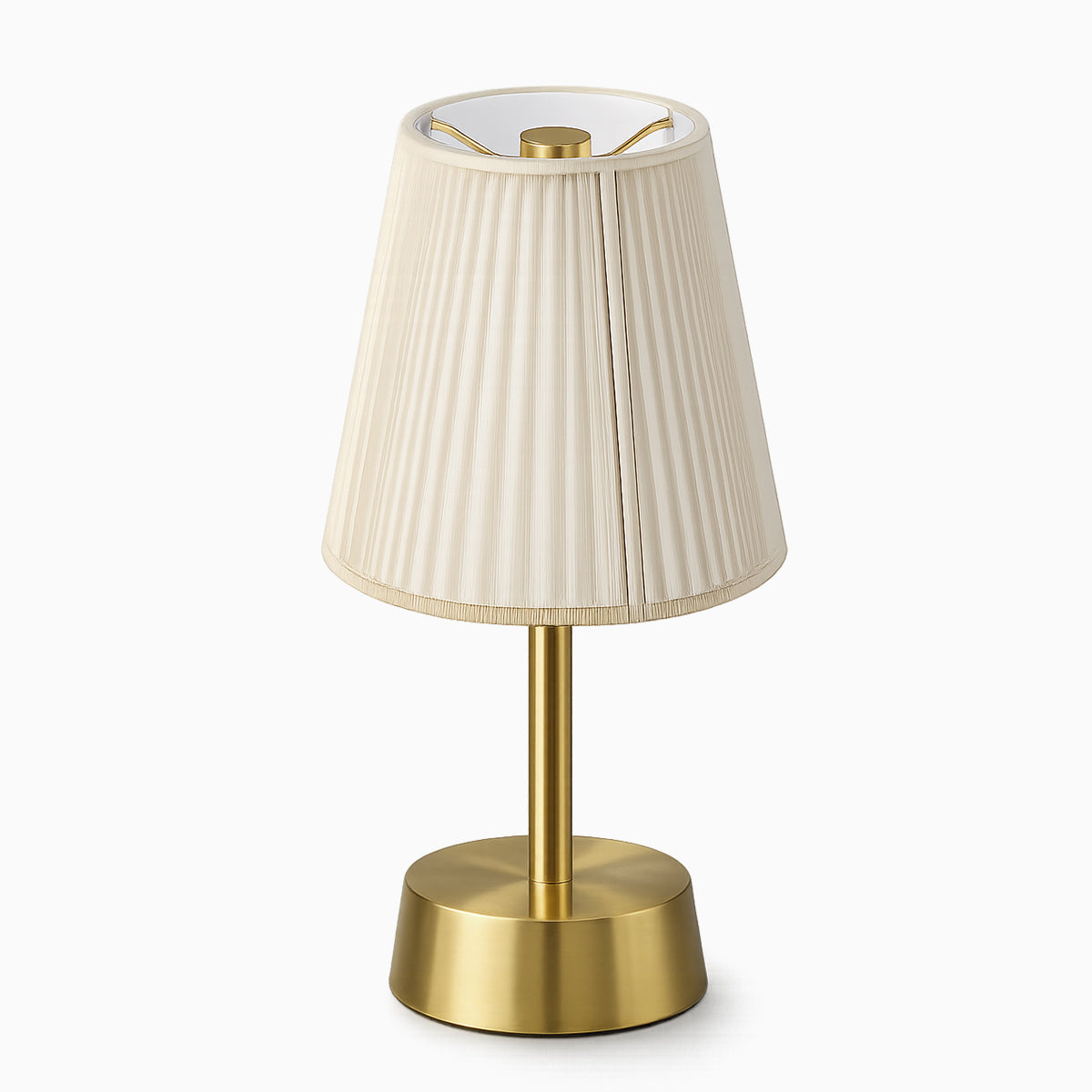 Cordless table lamp with a cotton ivory shade and brass base on a white background