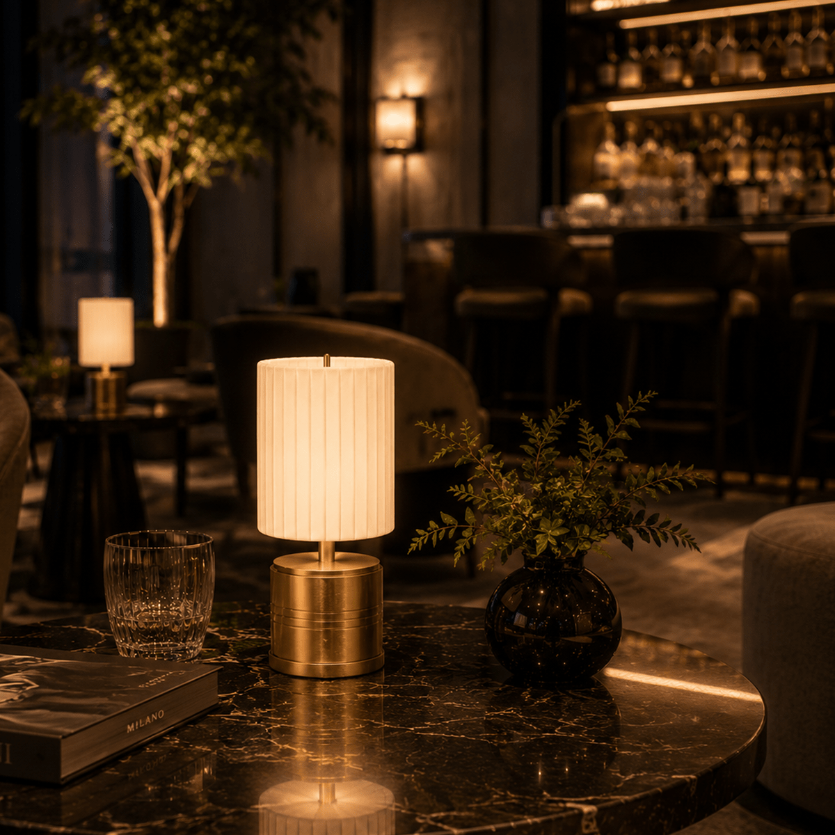 Decorative rechargeable lamp on a table in a dimly lit bar or restaurant setting