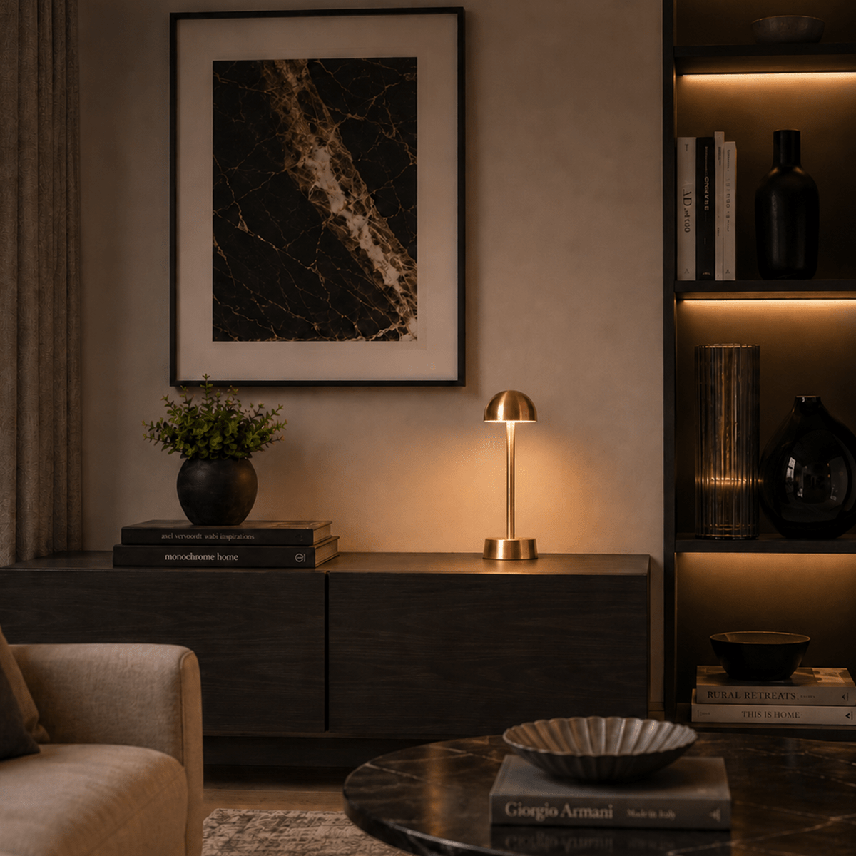Modern living room with a dark wooden cabinet, rechargeable lamp, and framed artwork.