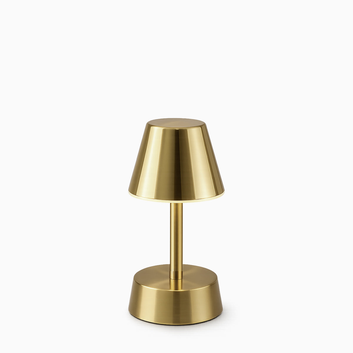 Brass cordless table lamp on a white background