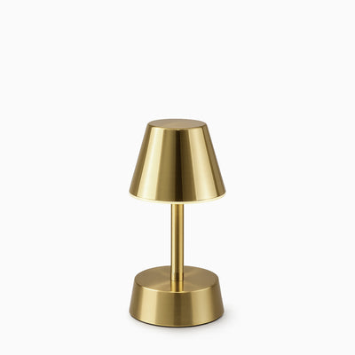 Brass cordless table lamp on a white background