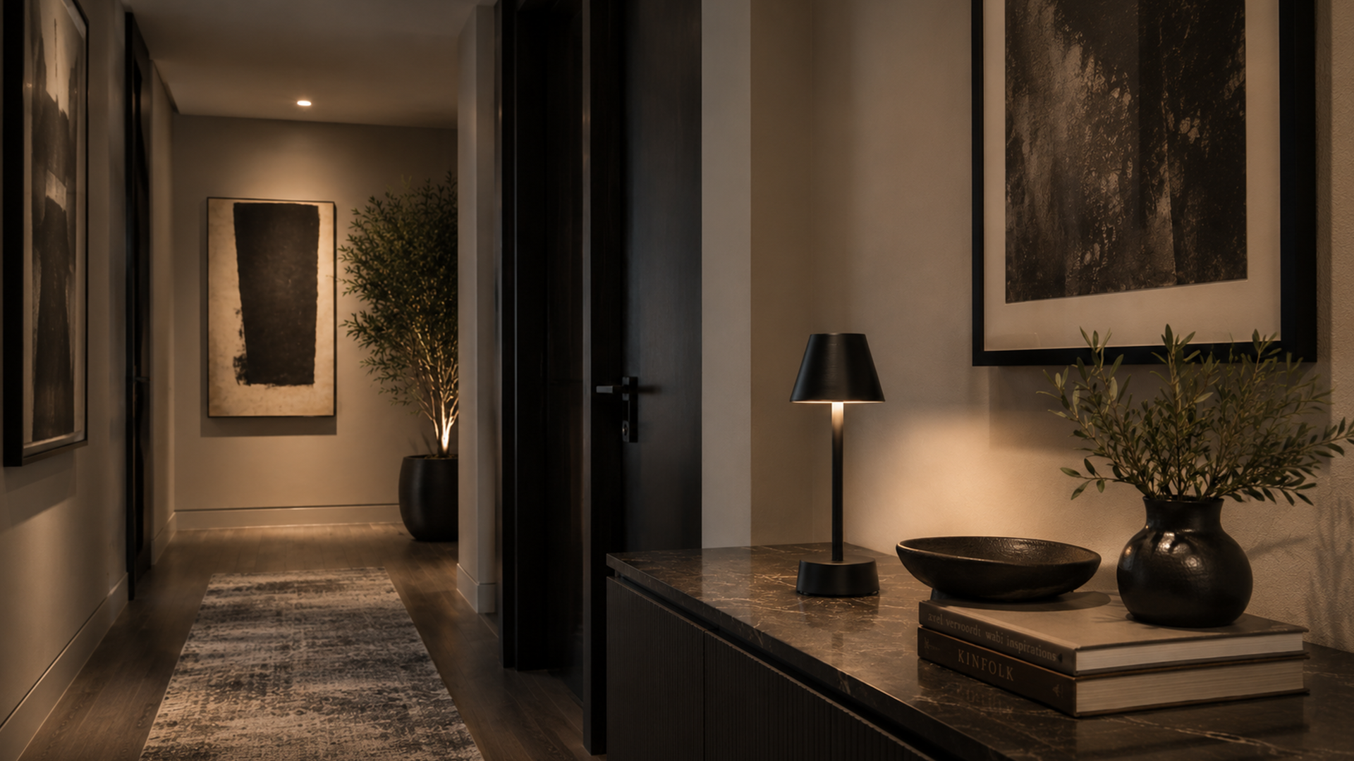 Modern interior hallway with a black rechargeable lamp, decorative elements and ambient lighting.