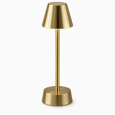 Brass cordless table lamp on a white background